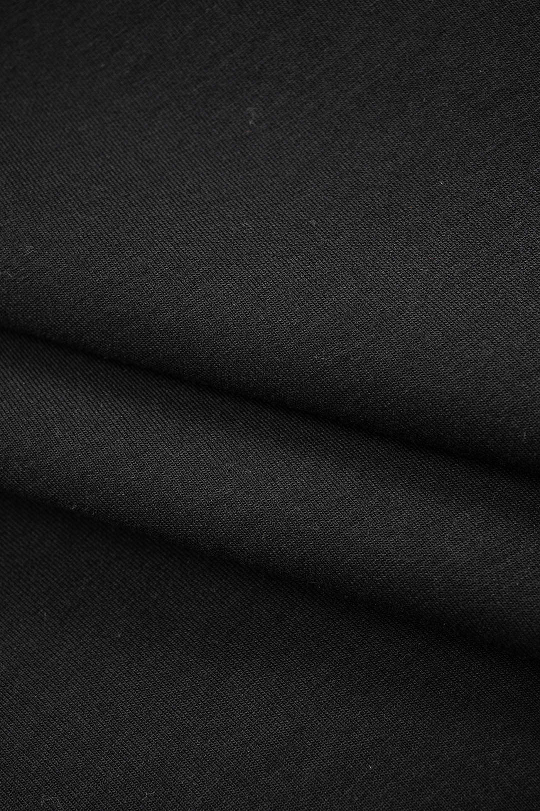 Bluza damska z ozdobnymi oczkami na rękawach