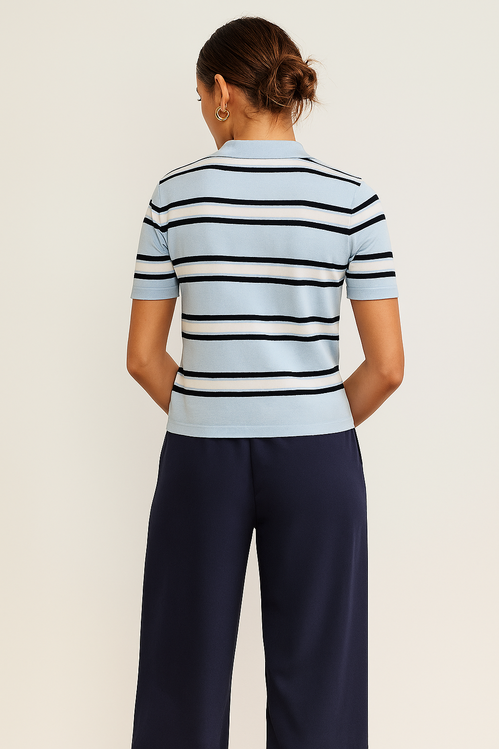 Spodnie z paskiem i podwiniętymi nogawkami